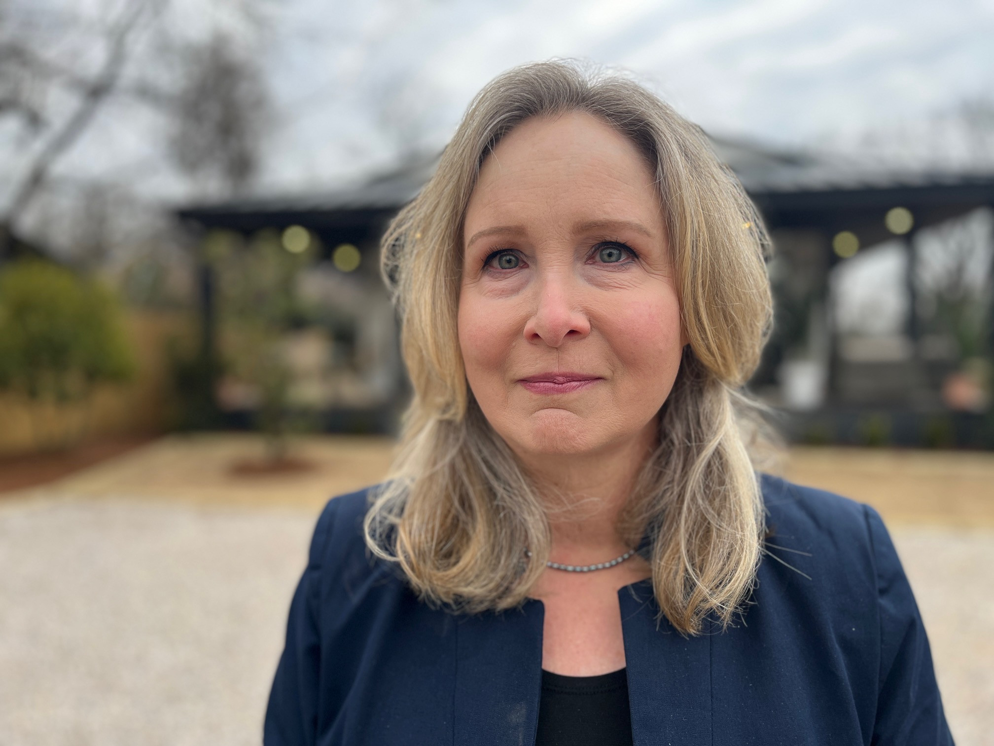 Sara Lichfield standing in front of the Momo Otium project in Birmingham, Alabama.