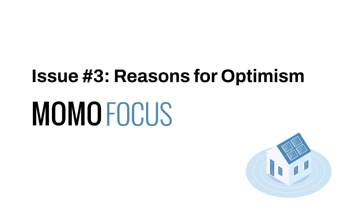 Momo Focus logo -- a simple house with solar panels, sitting at the center of concentric circles.